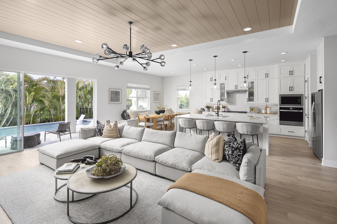 great room with pendant lighting and open concept flow into the kitchen area
