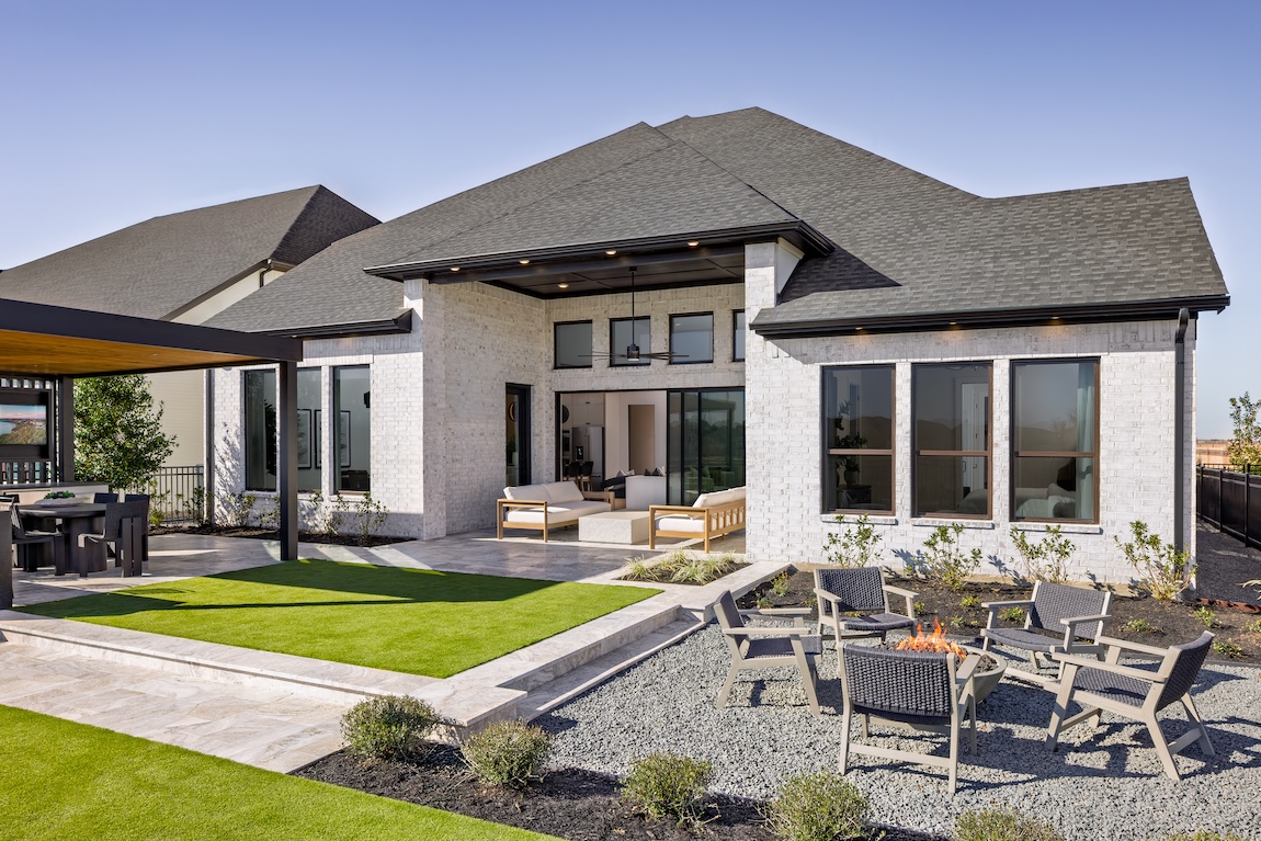 backyard area of home with fire pit and seating areas