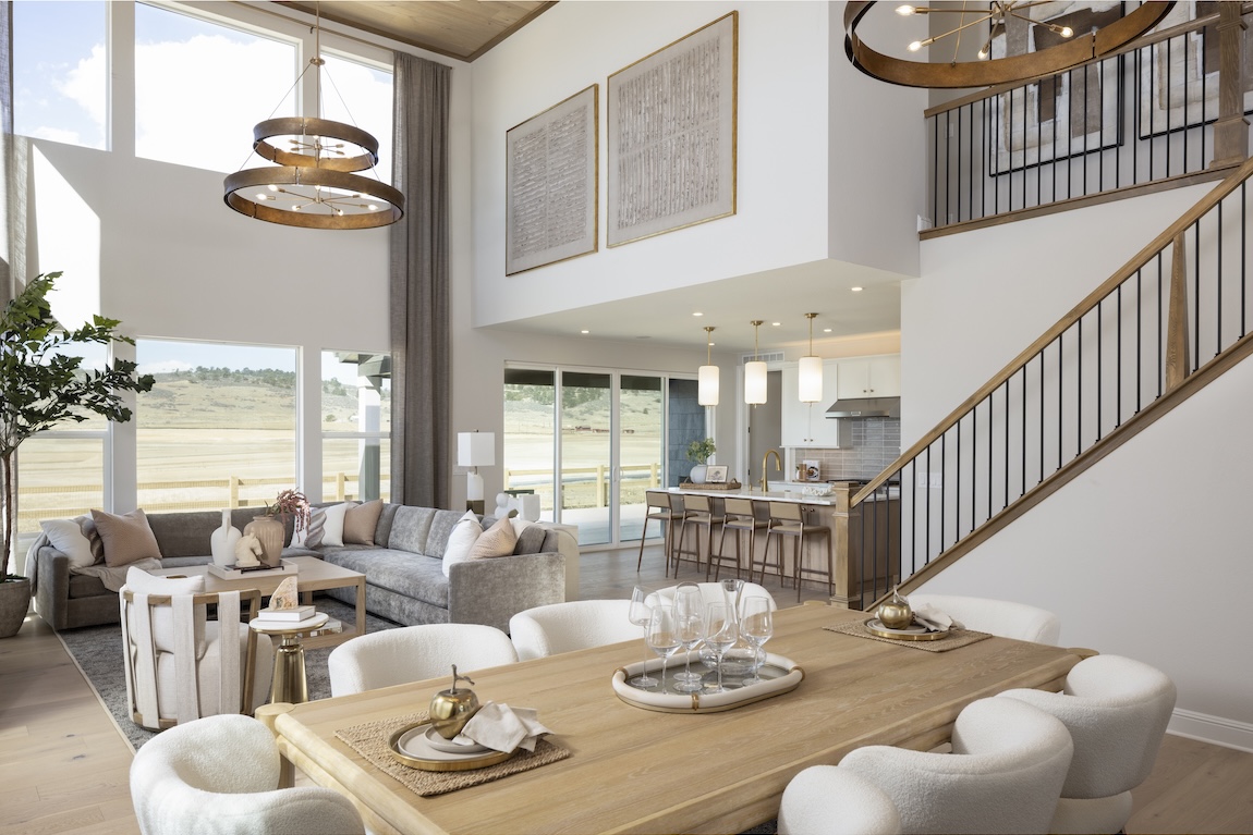 open-concept living space with sofa and dining spaces.