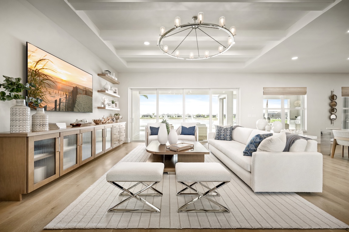 living room with white furniture and blue accents