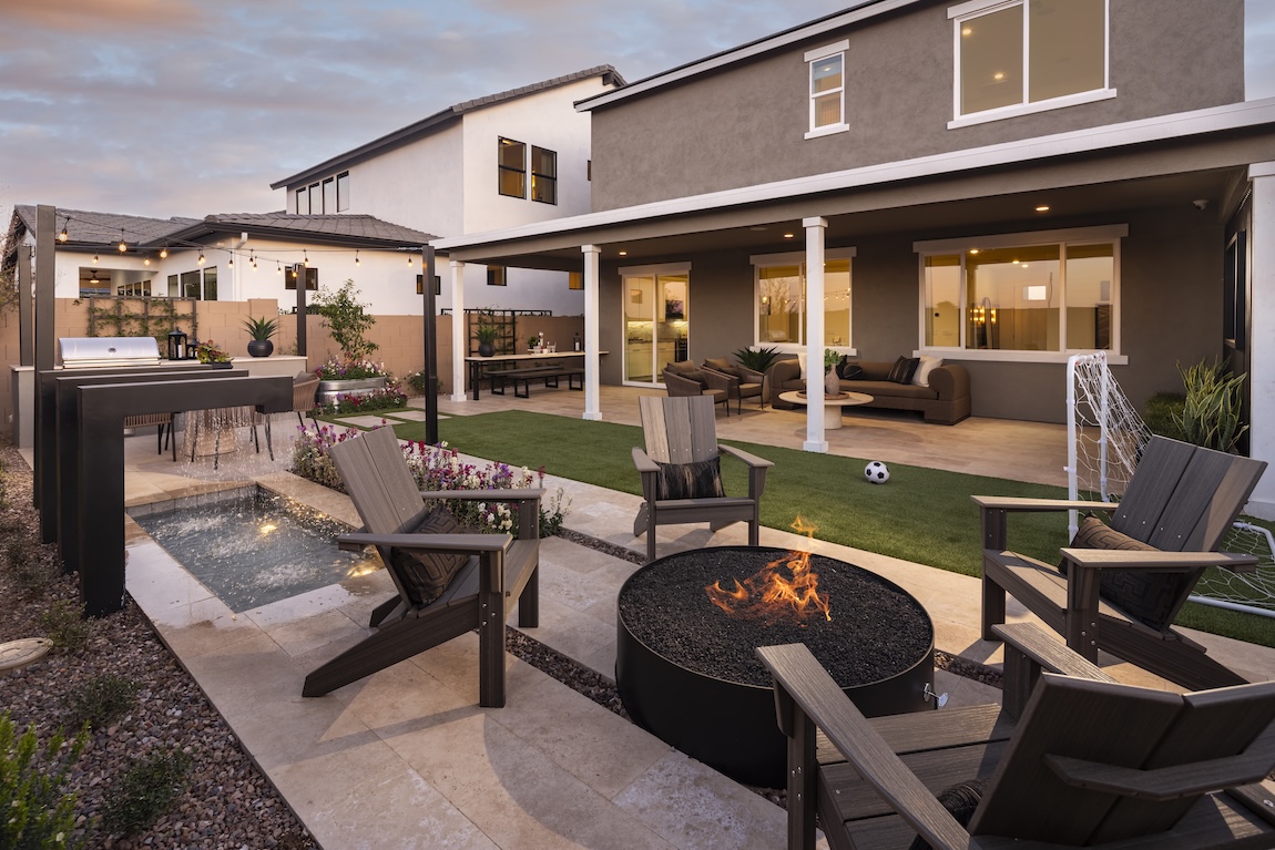 outdoor fire pit with chairs surrounding