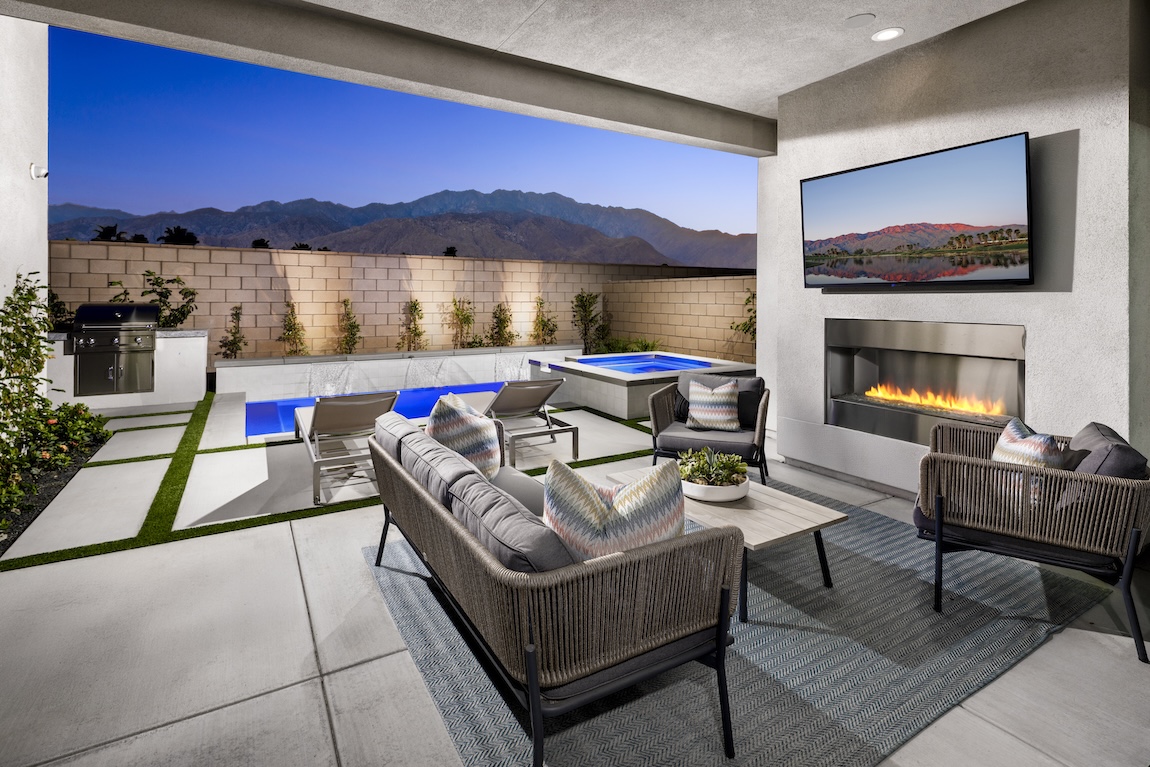 indoor-outdoor living space with couch and lounge seating