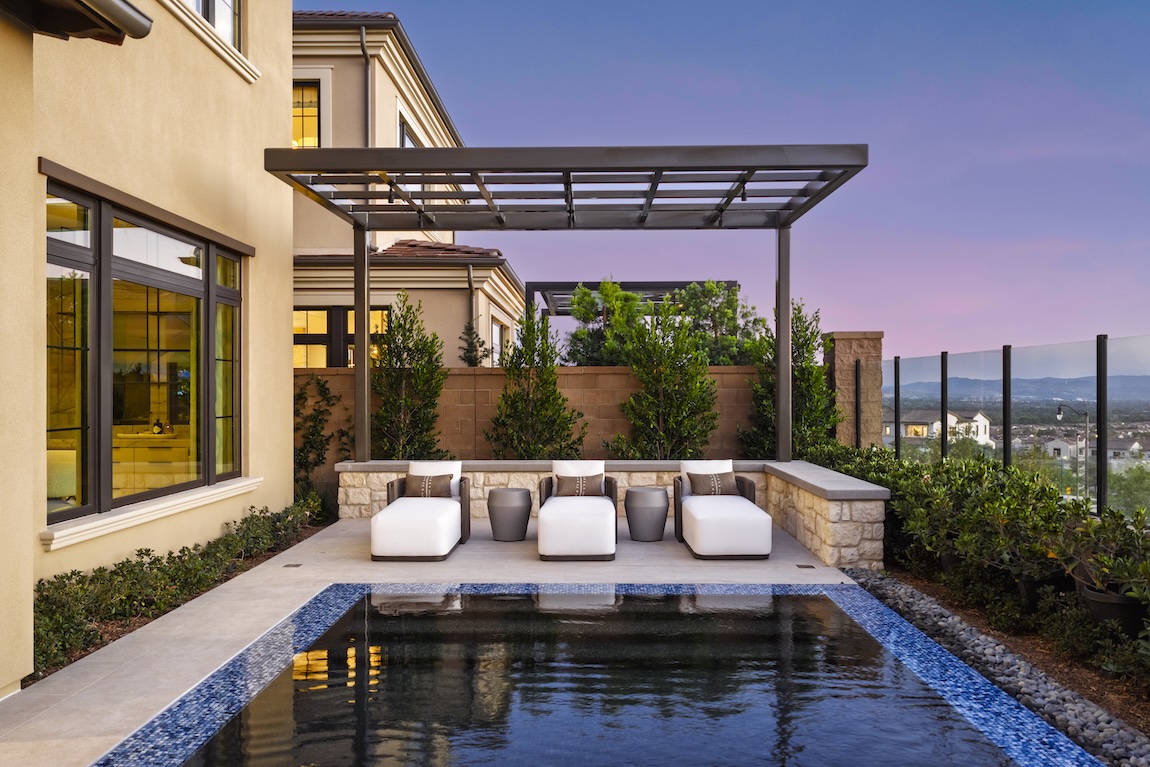 outdoor pool with lounge chairs and pergola