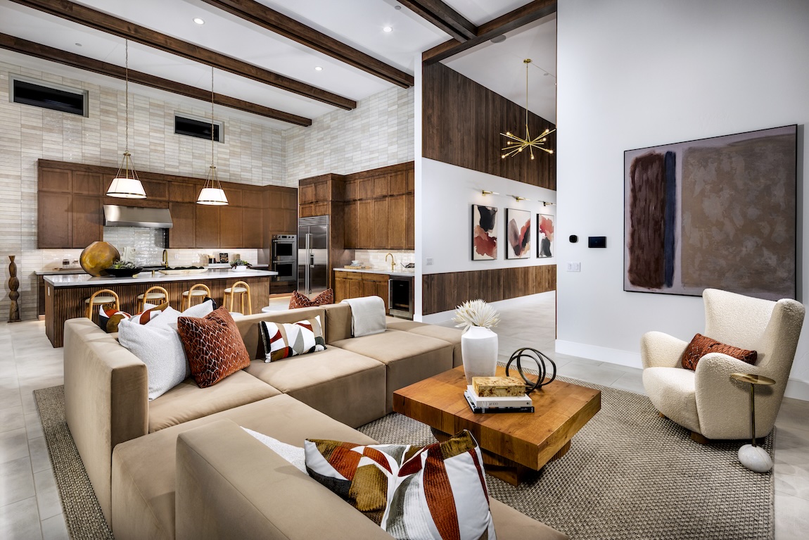 living room with large sectional sofa and neutral color palette