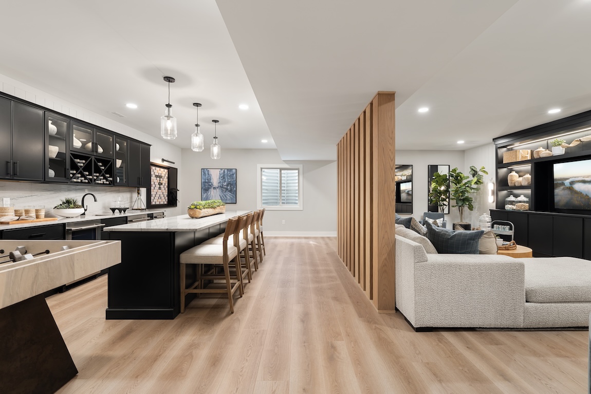 basement with couch space and bar area.