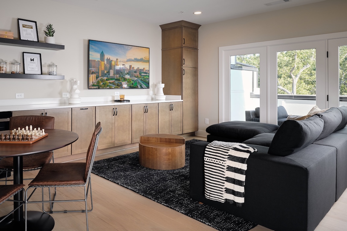 basement space with a couch and game table
