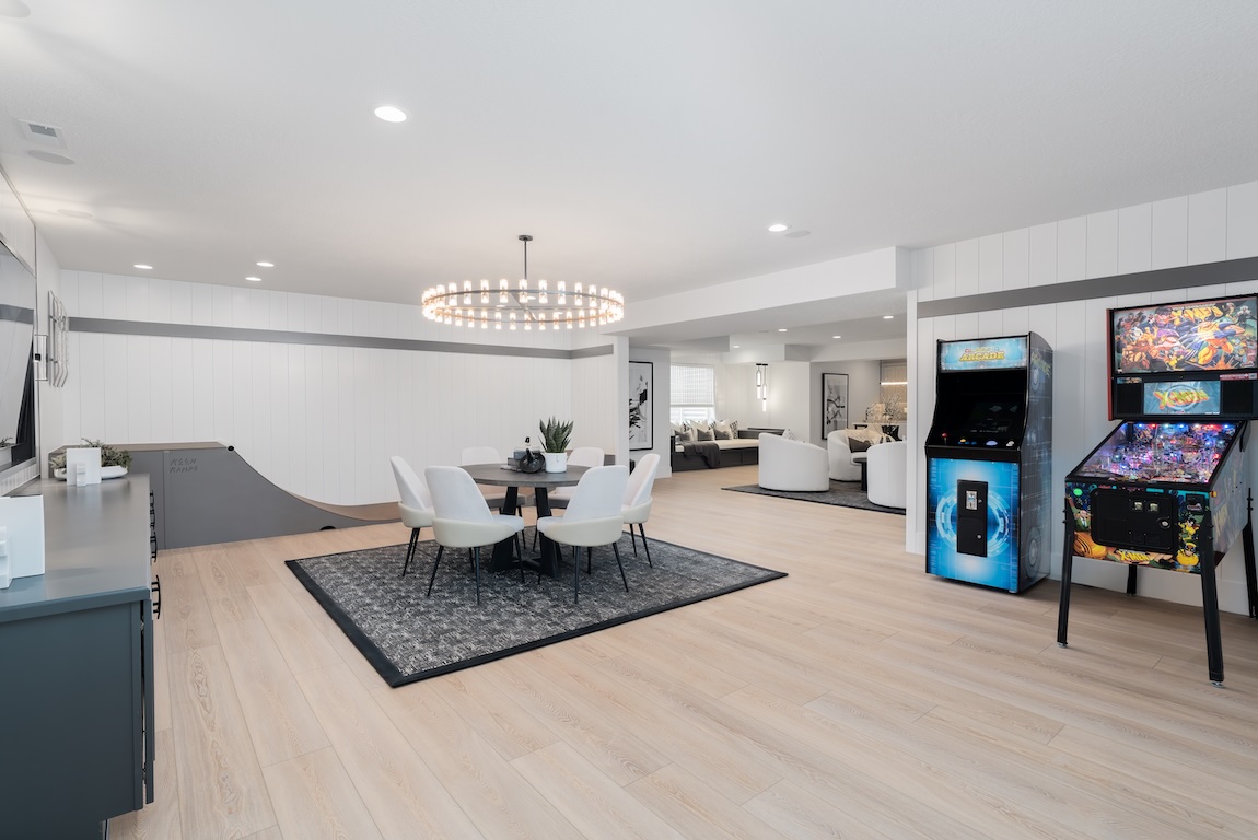 basement with game room and arcade games