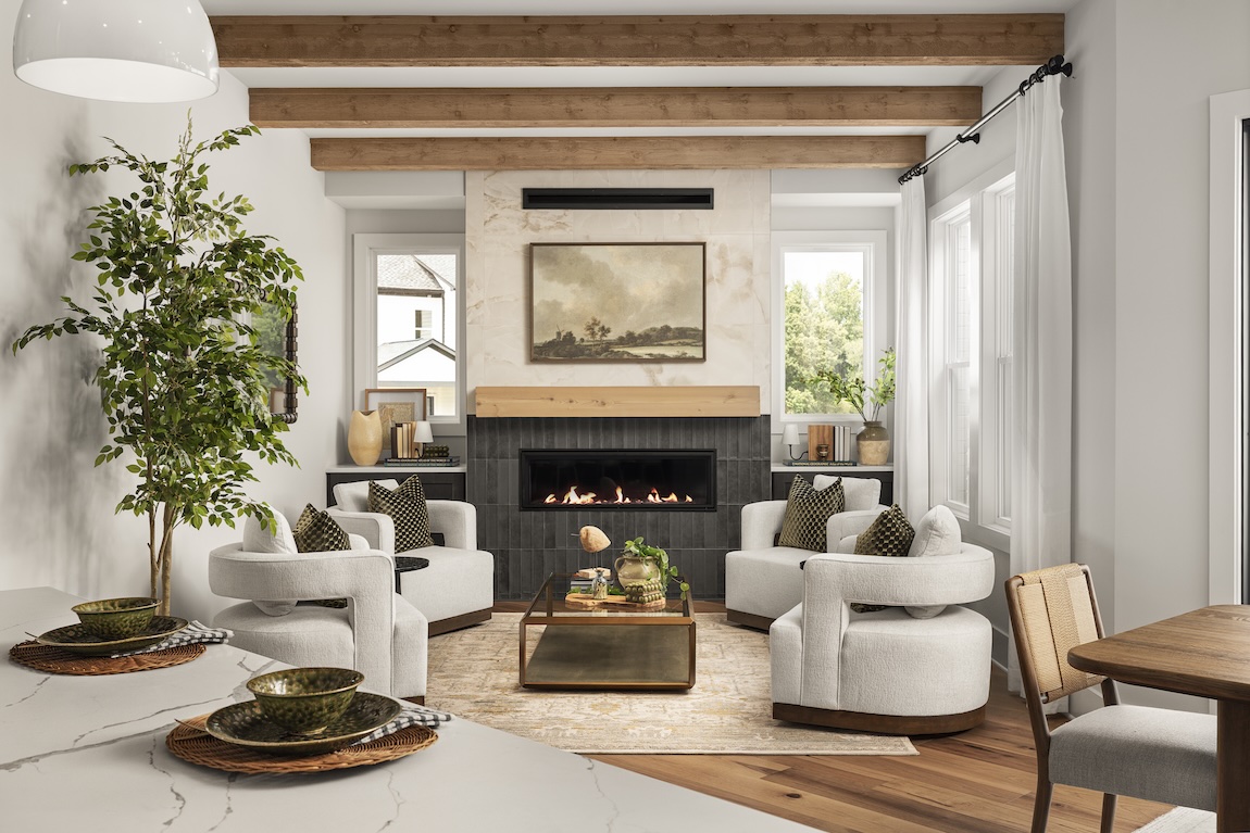Luxury great room with fireplace, exposed wood ceiling beams, and four-chair conversation area.