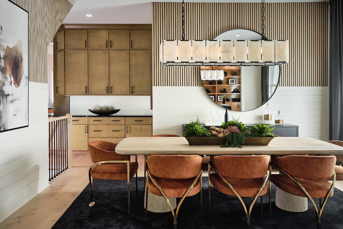 dining room table with orange velvet seating