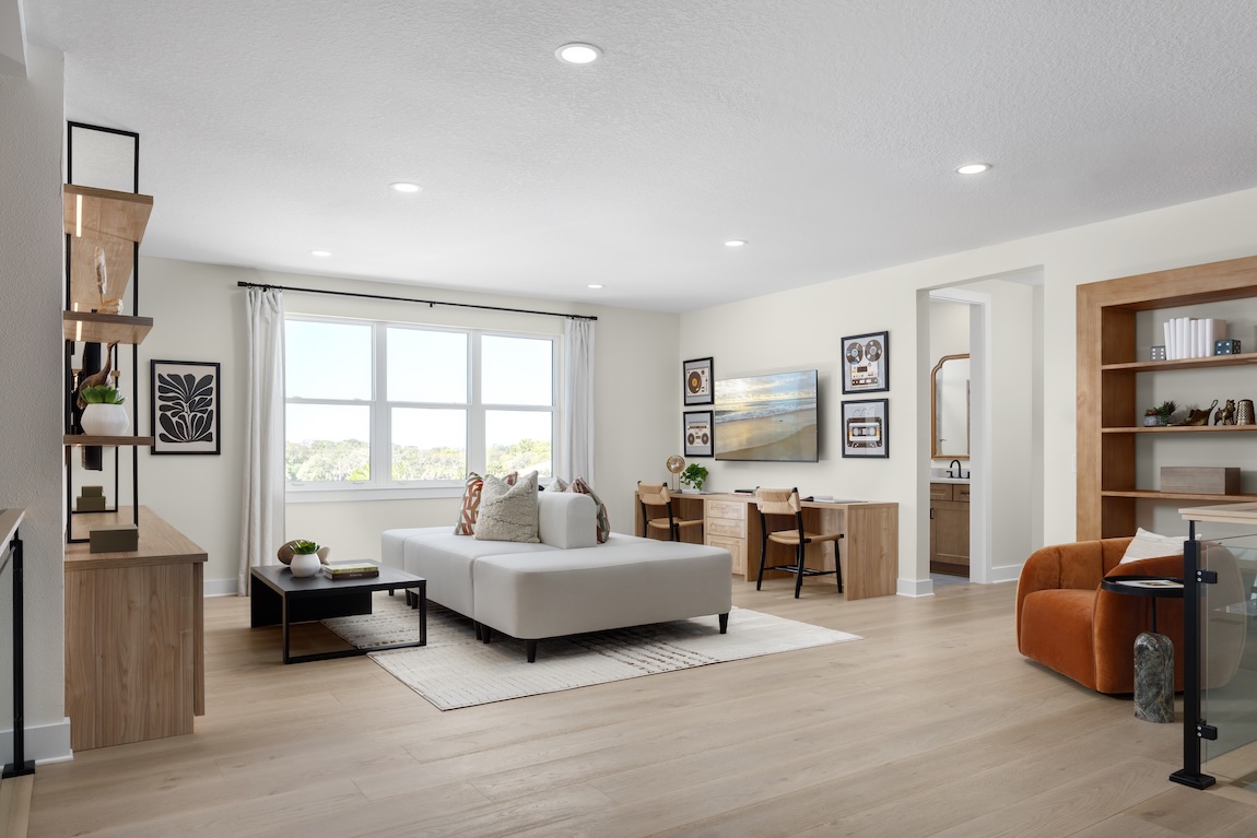 flex room with desk and couch