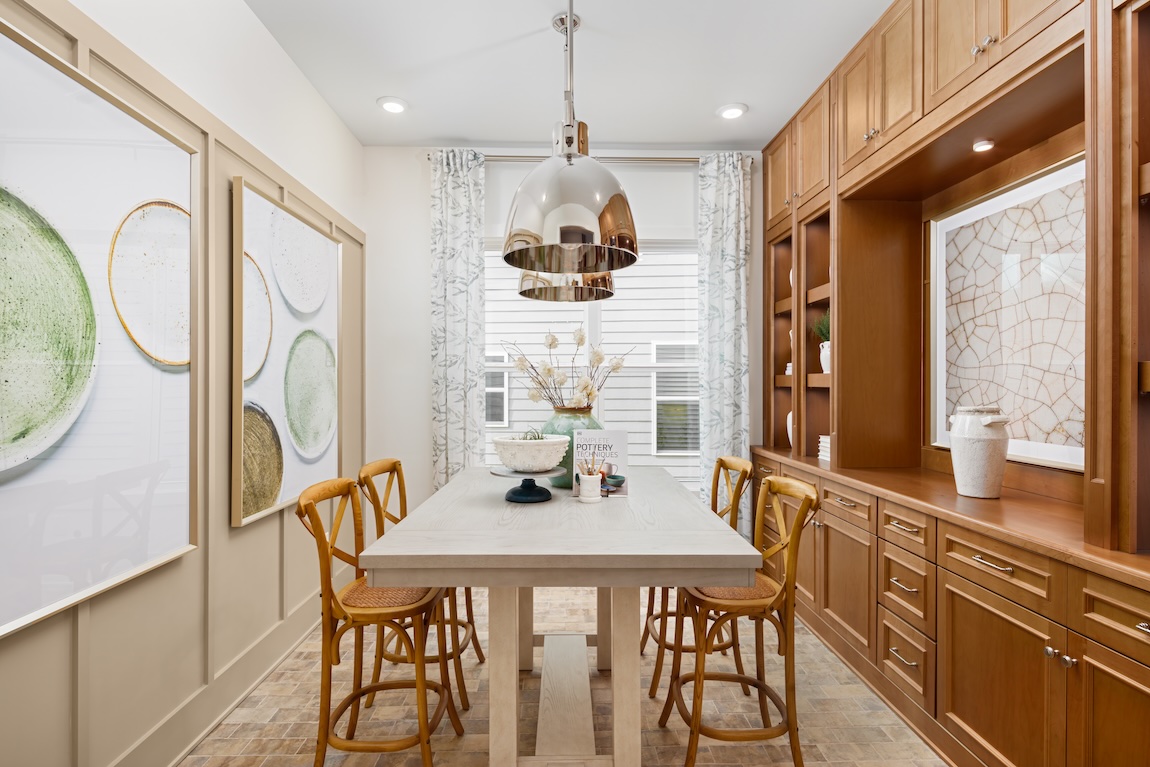 flex room with craft table and pendant lighting