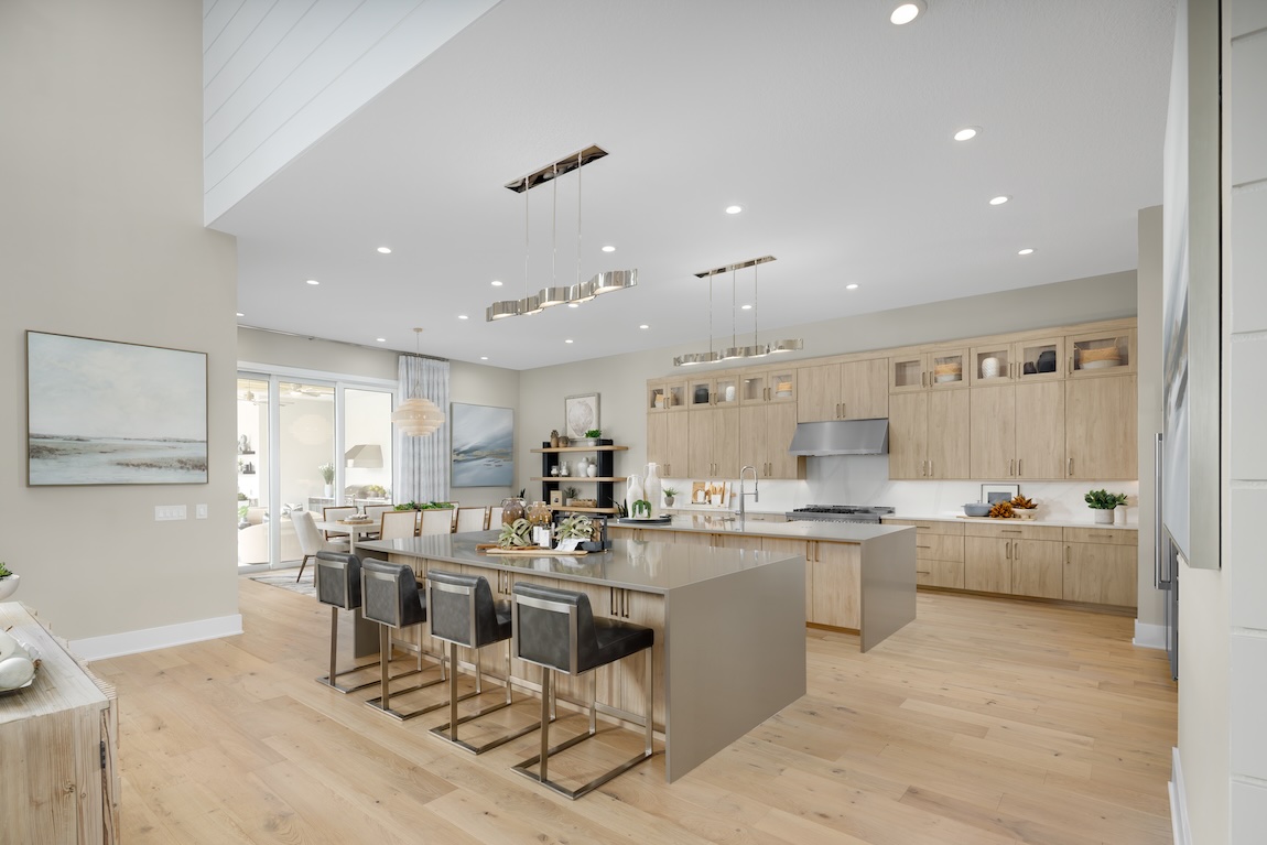 large kitchen with wooden cabinetry and dining space attached