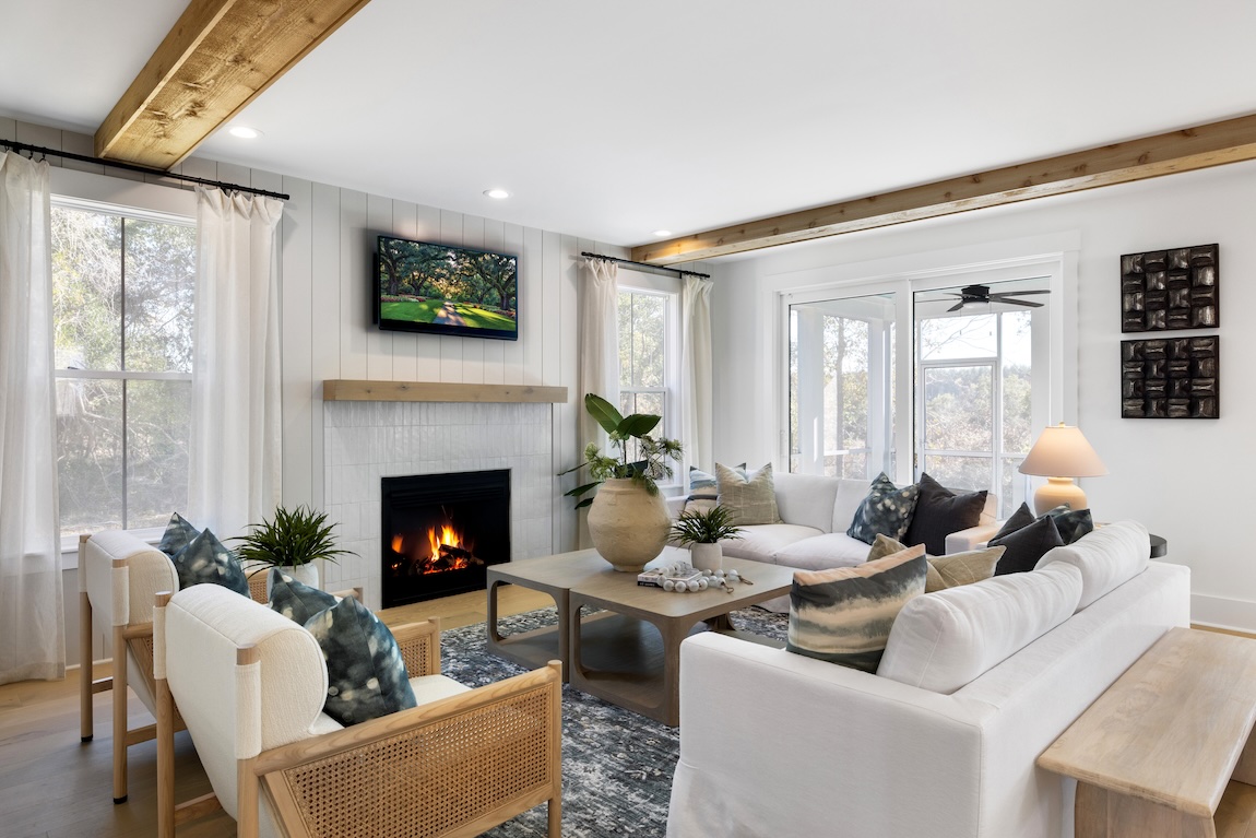 living room with fireplace and natural light