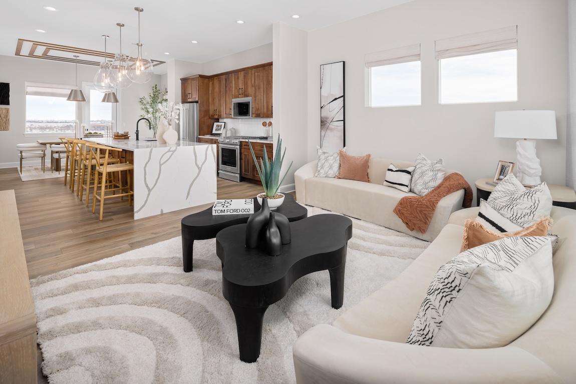 contemporary living space with patterned carpet and seating
