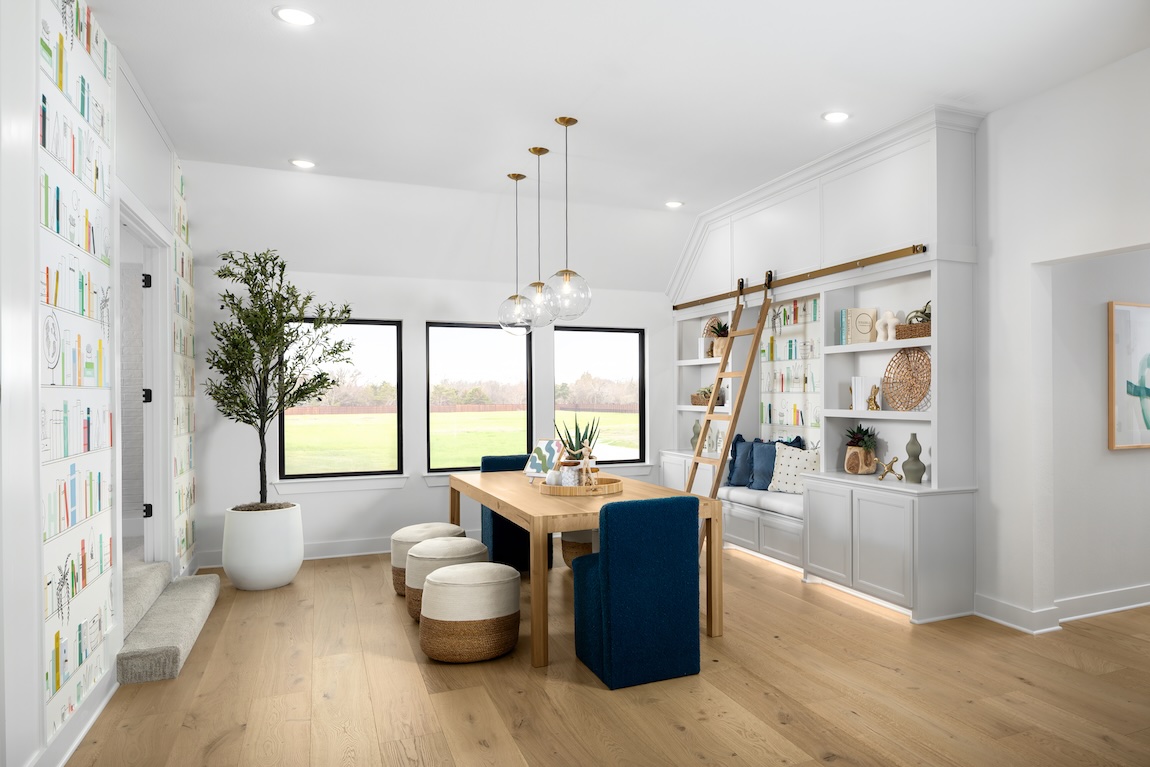 craft room with wooden table and creative wallpaper