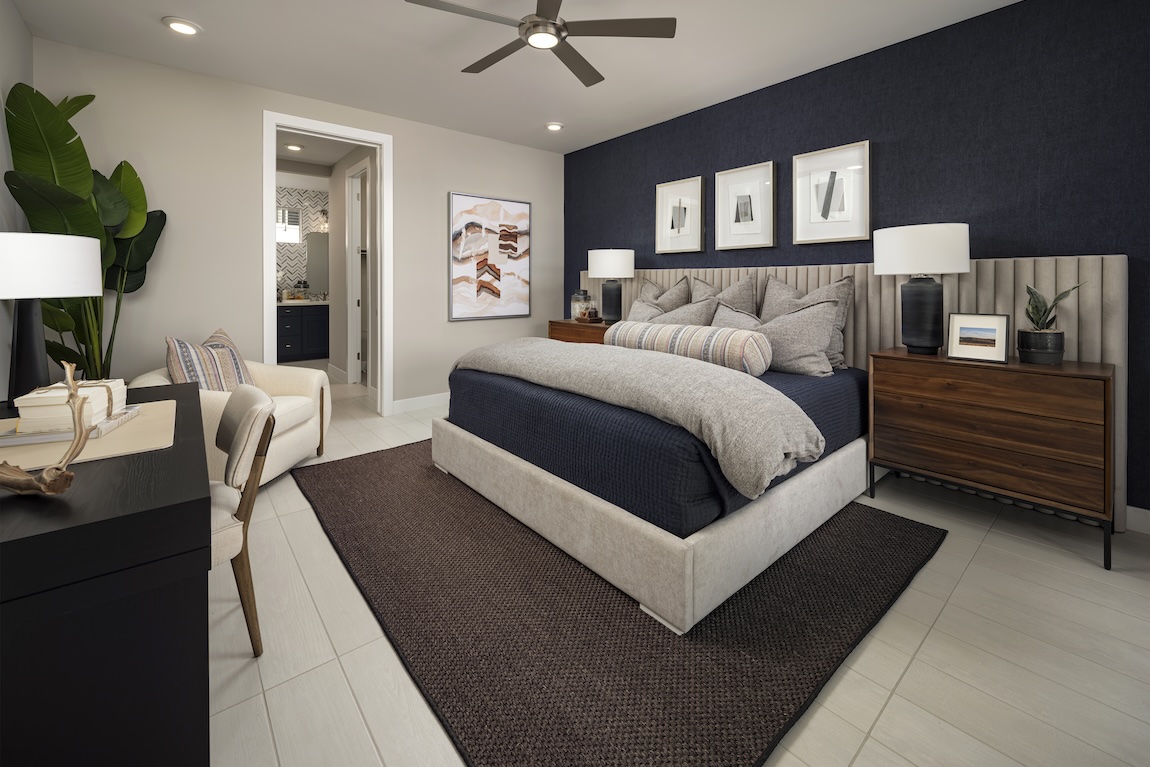 primary bedroom with dark blue wallpaper and design