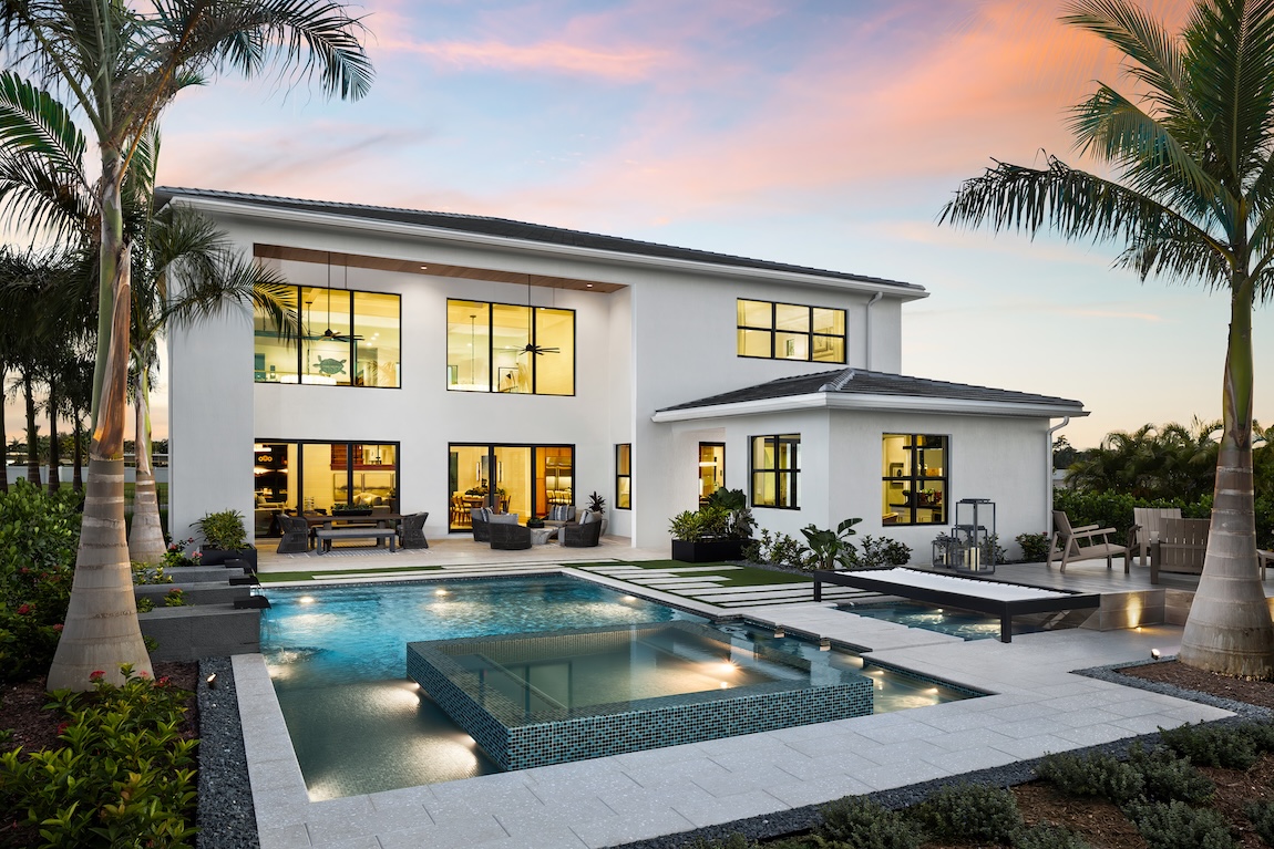 home exterior with warm interior lighting