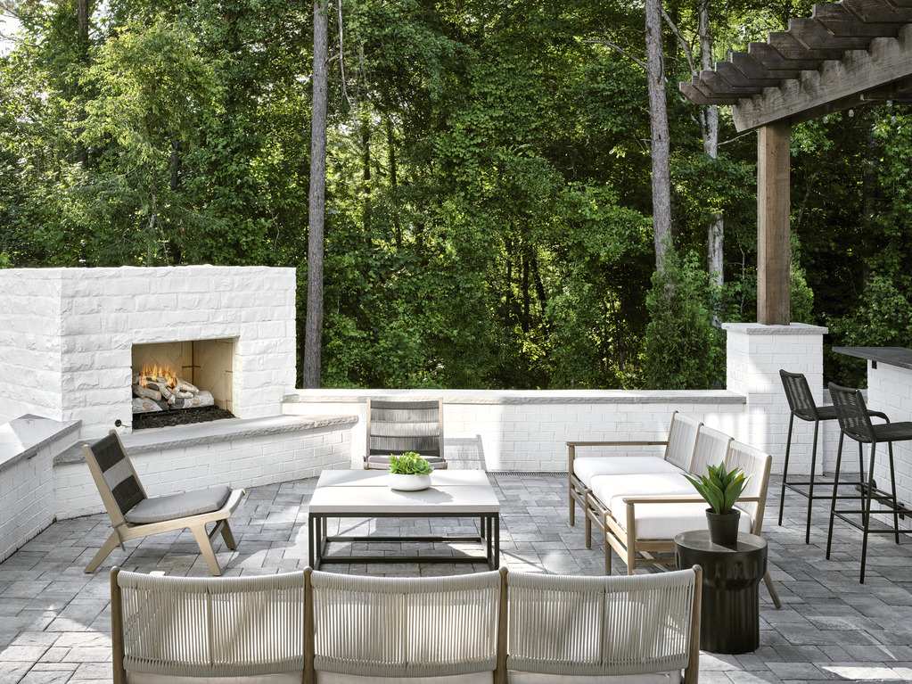 modern outdoor seating area with corner fireplace