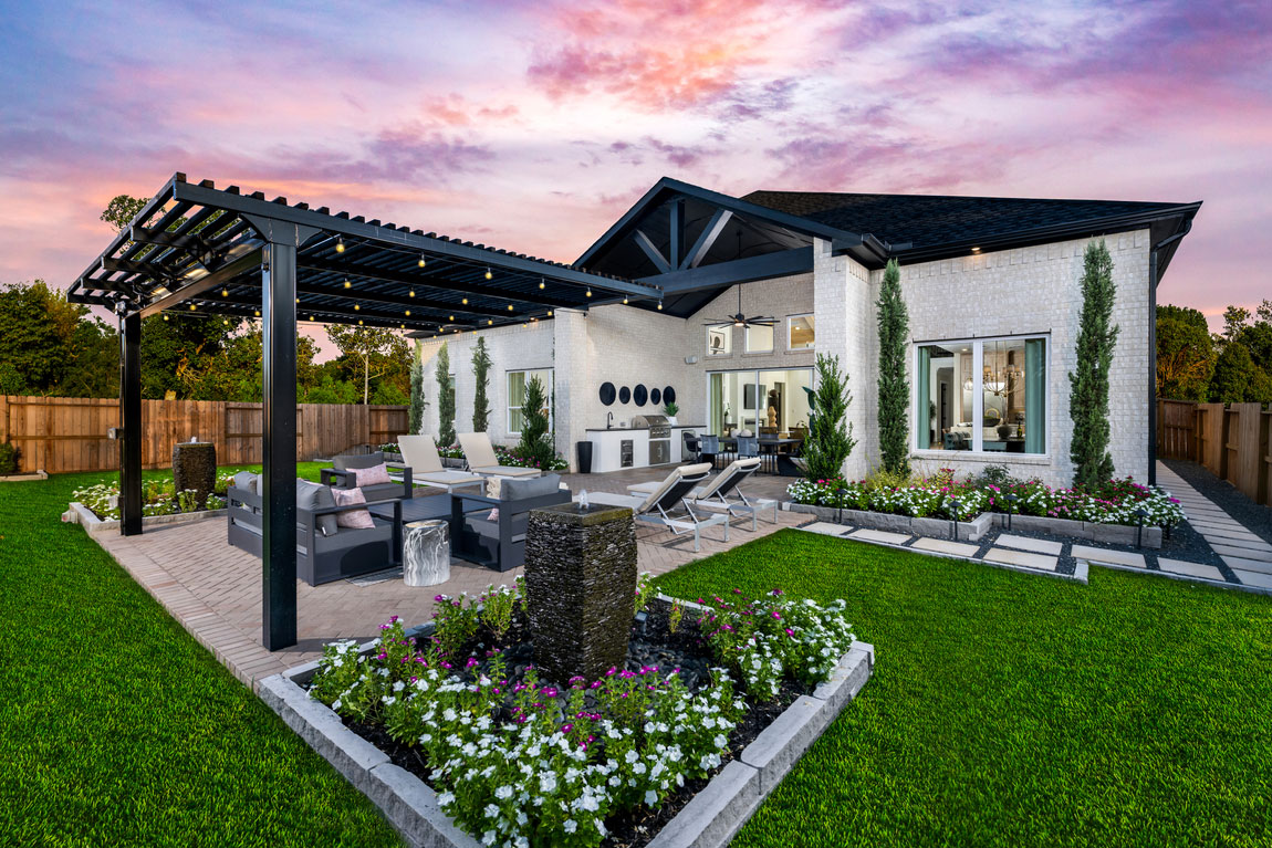 luxe modern backyard design with greenery.