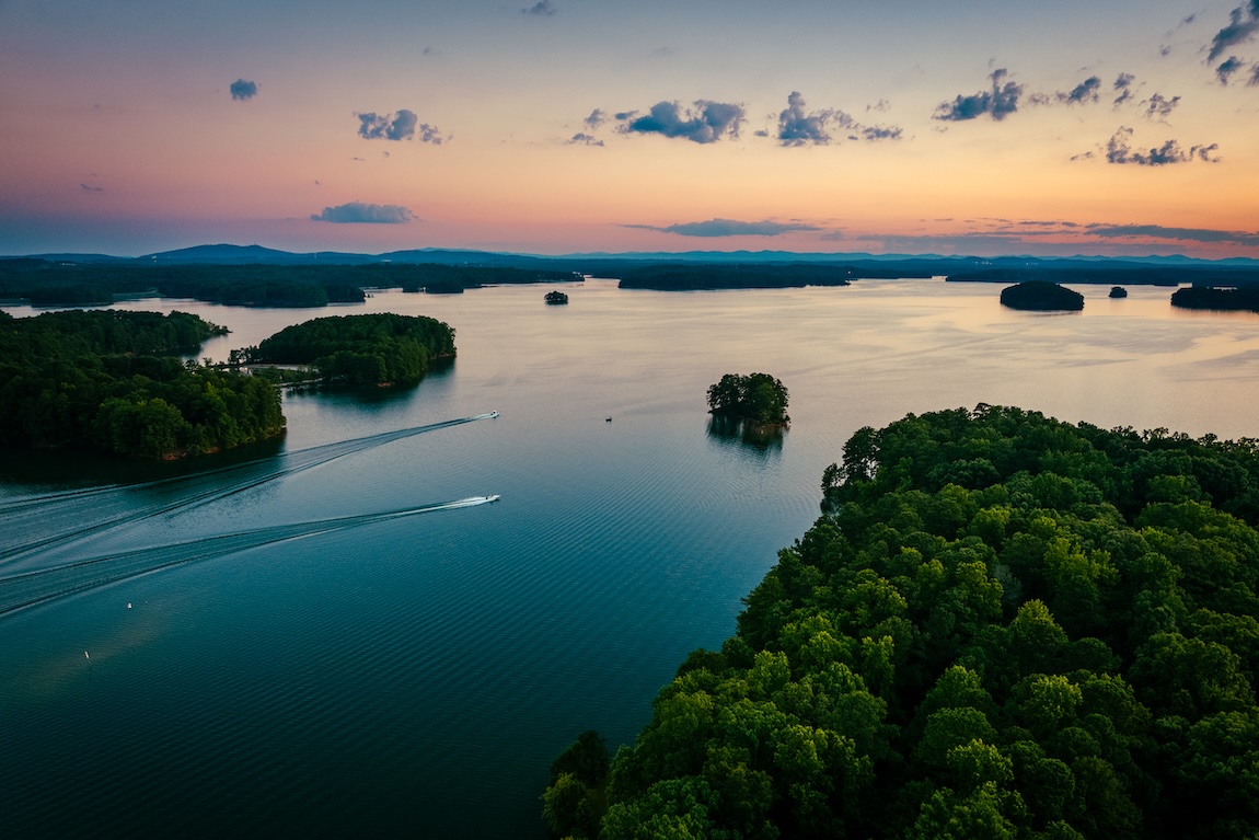 Ariel view of Lake Lanier at sunset with boats