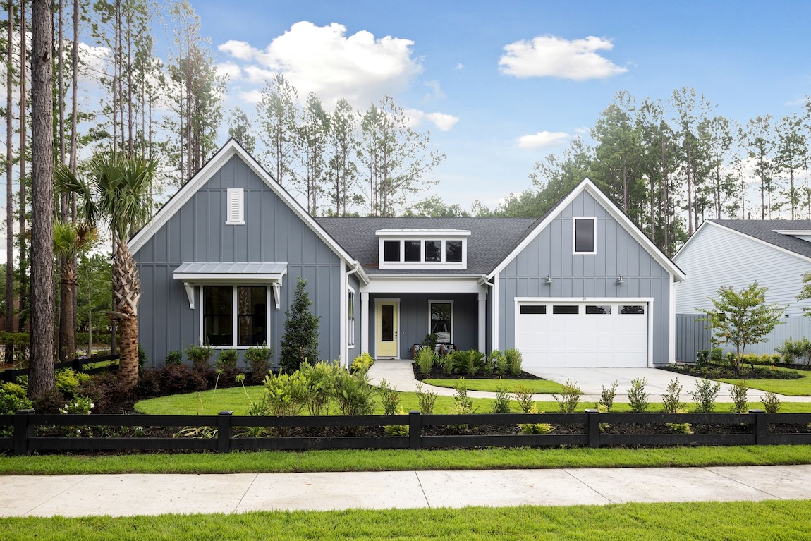 Bungalow-style quick move-in home in Hardeeville, SC with a gray blue exterior and yellow door