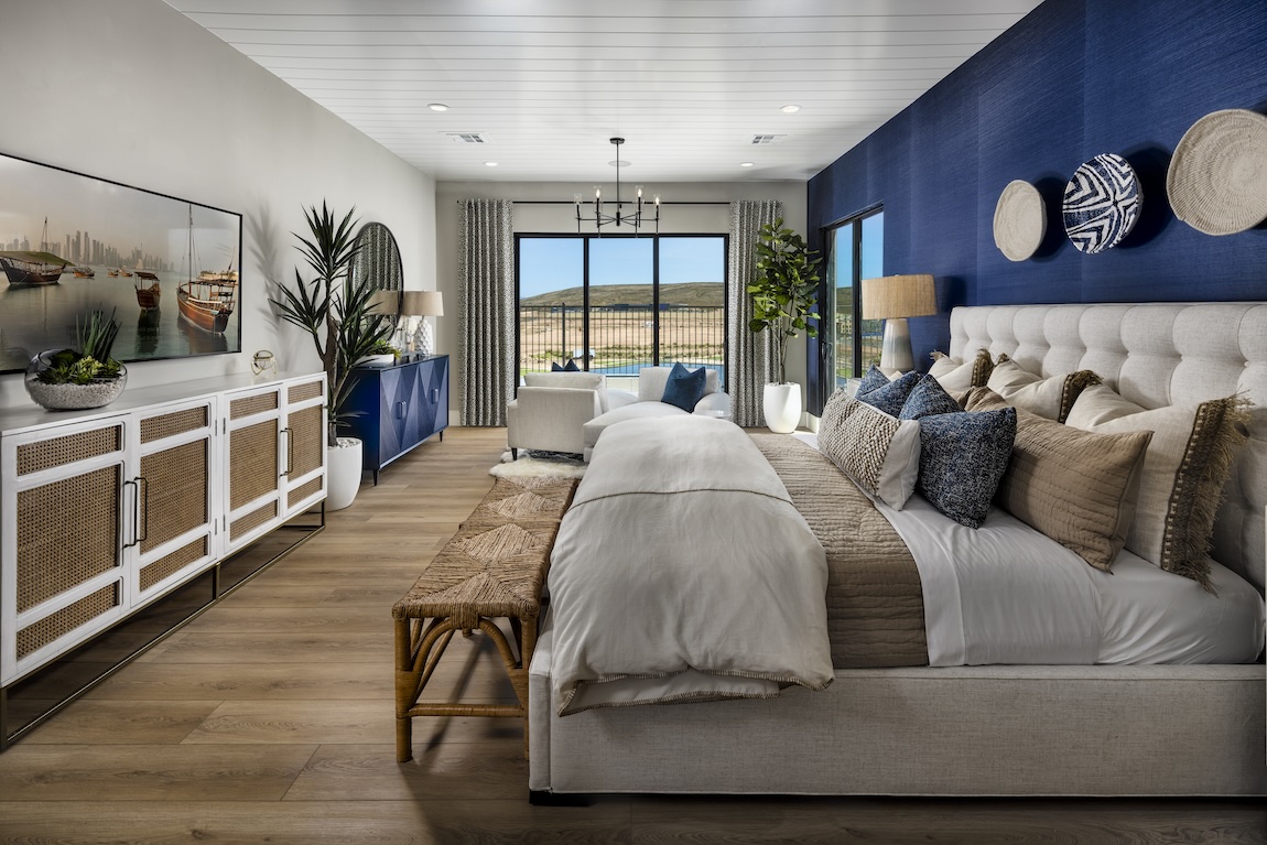 Spacious blue bedroom design with outdoor transition