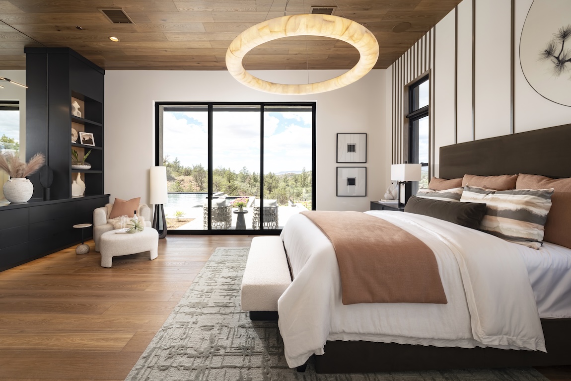 primary bedroom with doors to the outdoor living space