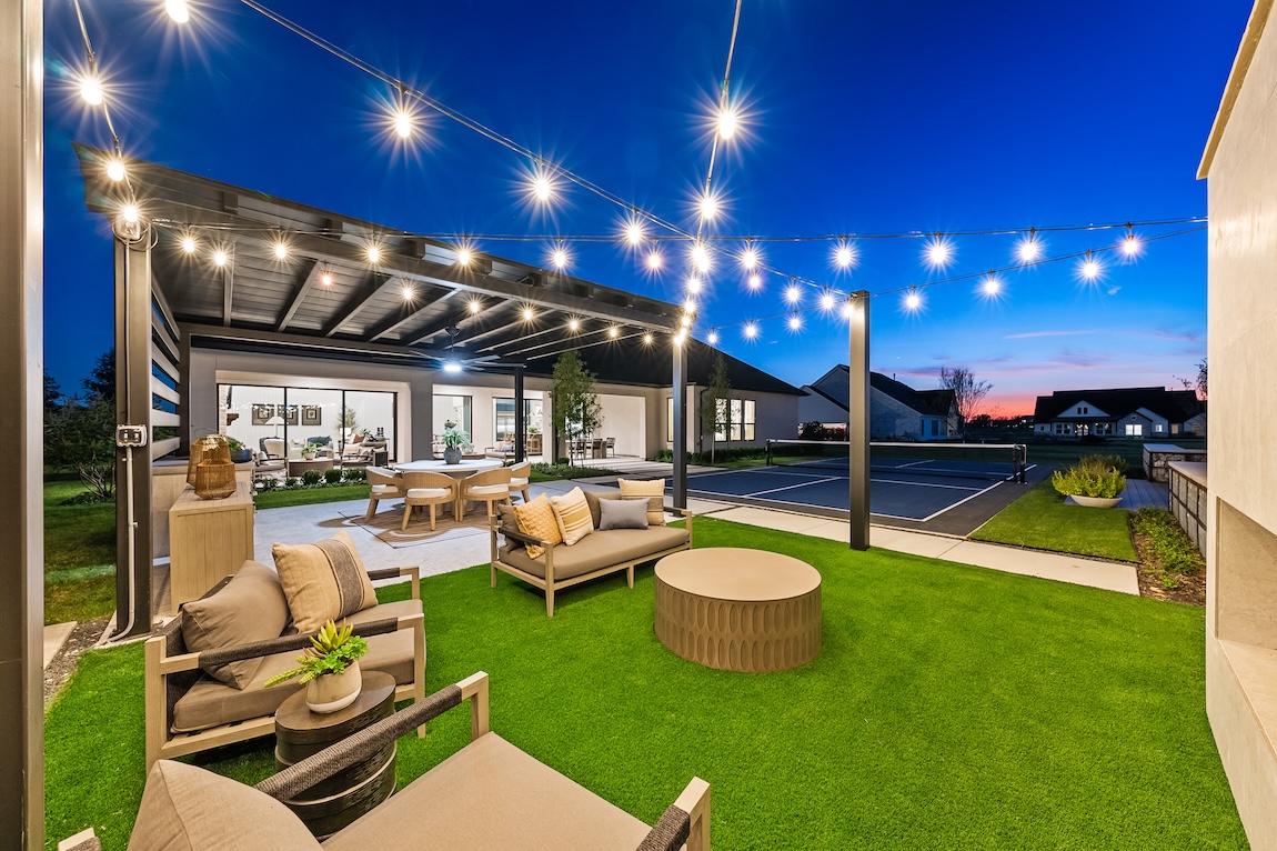 outdoor seating with pergola and string lights