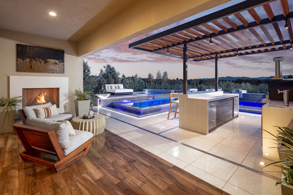 Pergola by the pool with integrated lighting to create a stunning evening oasis.