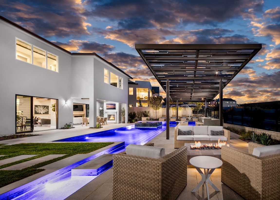 A dark metal design offers a sleek, shaded comfort in the poolside lounge space.