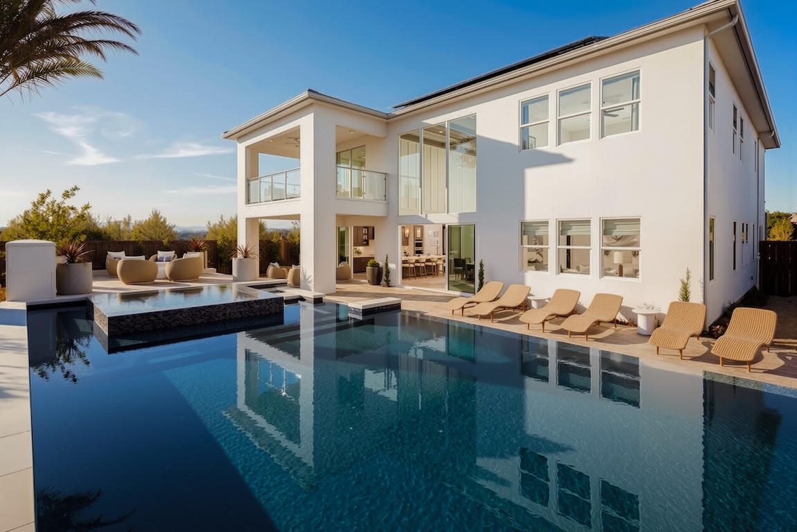 backyard pool with lounge seating and a covered patio area