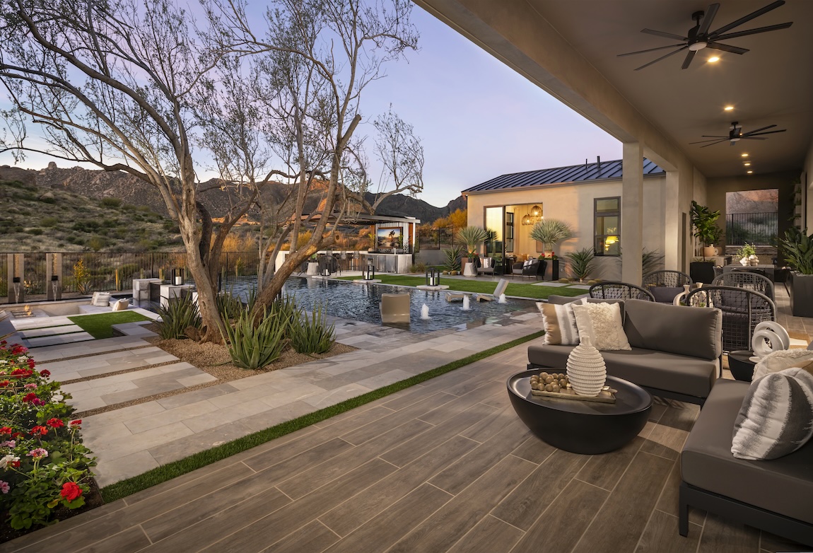 Backyard design featuring pool landscaping that blends natural elements with it's hardscape to create a natural sanctuary