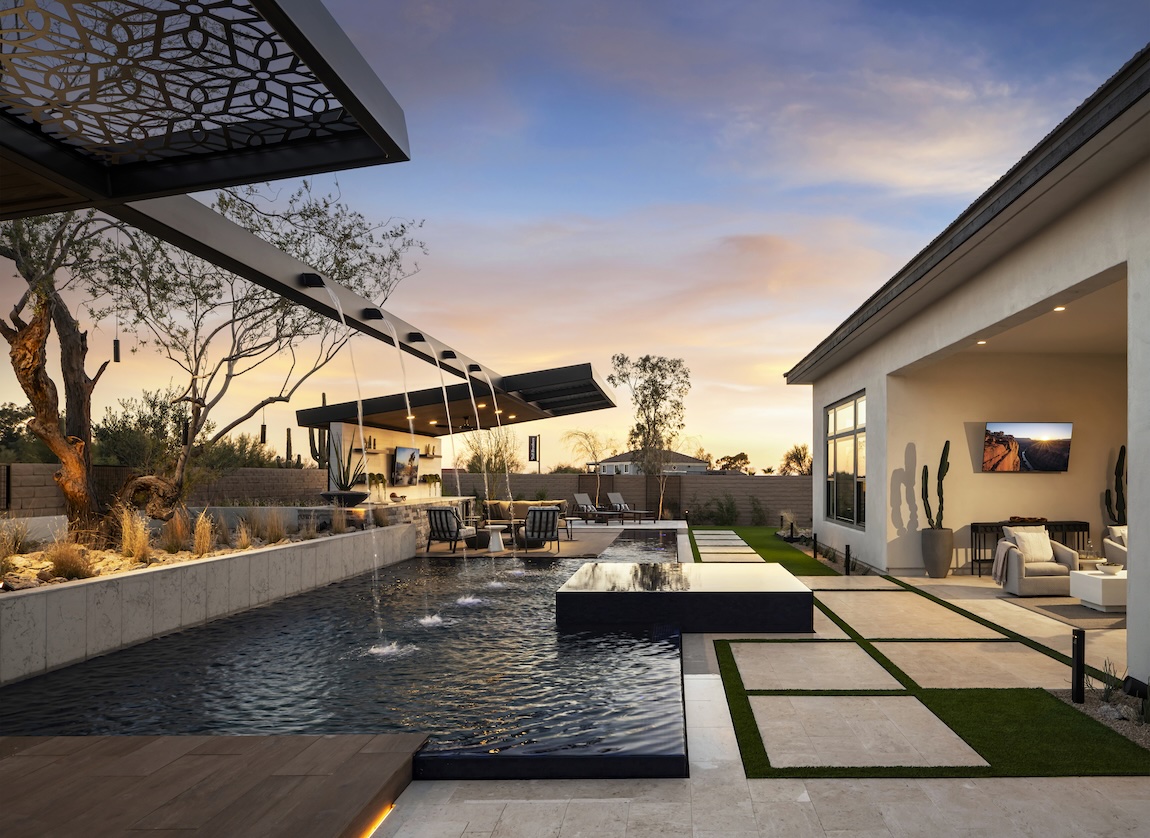 Innovative pool design highlighted by water features and sleek, contemporary feel