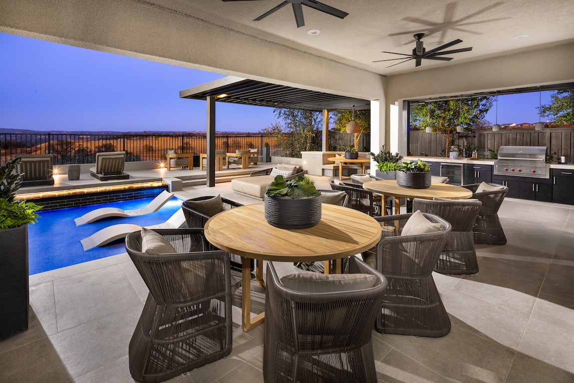 Modern barbecue space with cool-toned hues and warm wood furniture