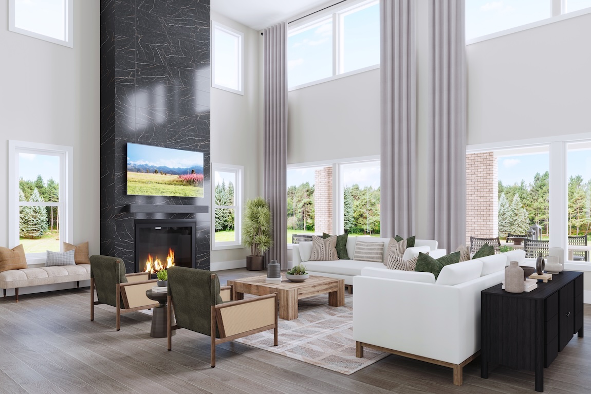 luxe two-story great room with accent fire place and natural lighting in ann arbor