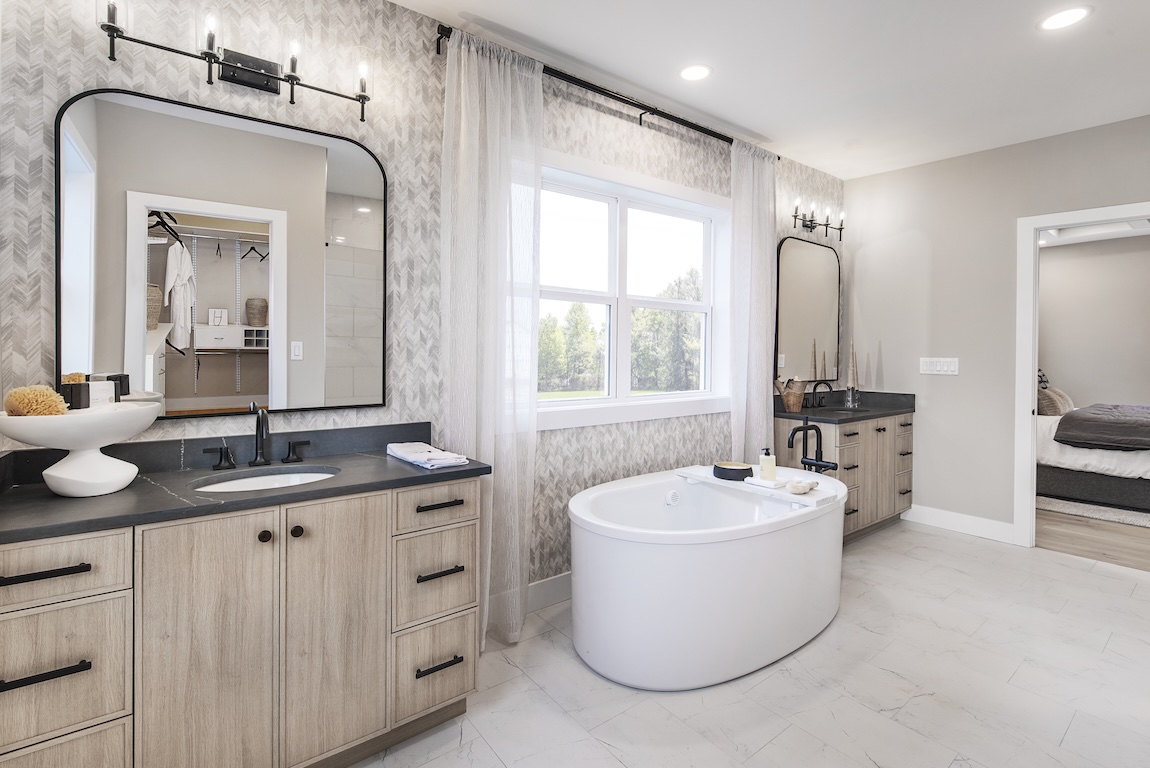 freestanding bathtub in modern farmhouse primary bathroom