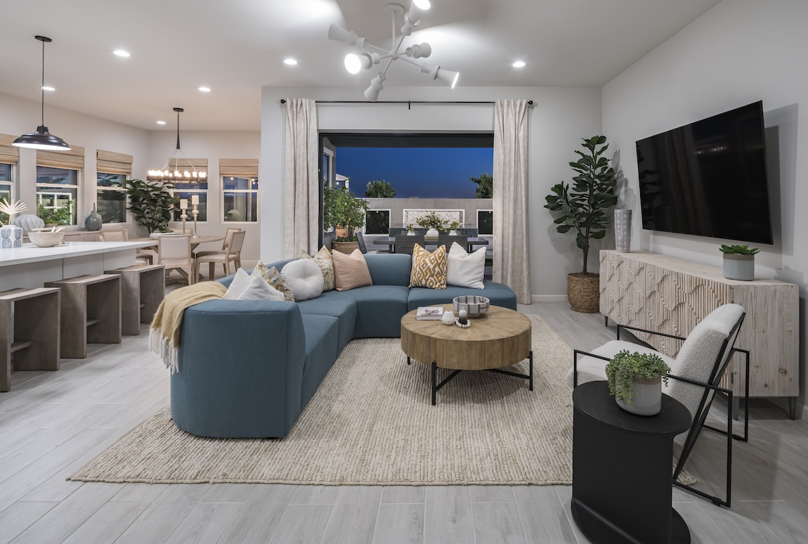 white living room featuring bold furniture, wood décor, and woven textures.