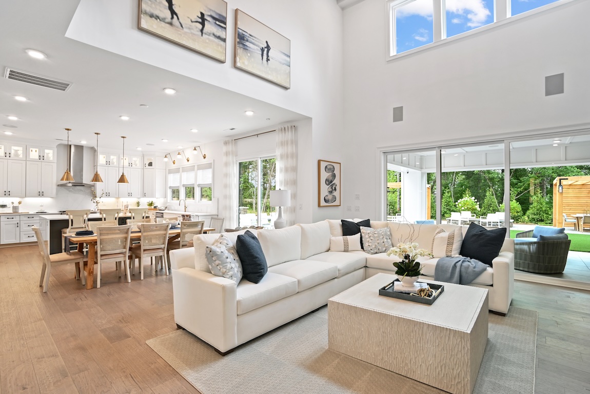 modern great room with sliding glass door access to the outdoor living space
