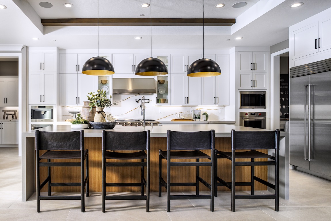 modern kitchen with black stools and lighting
