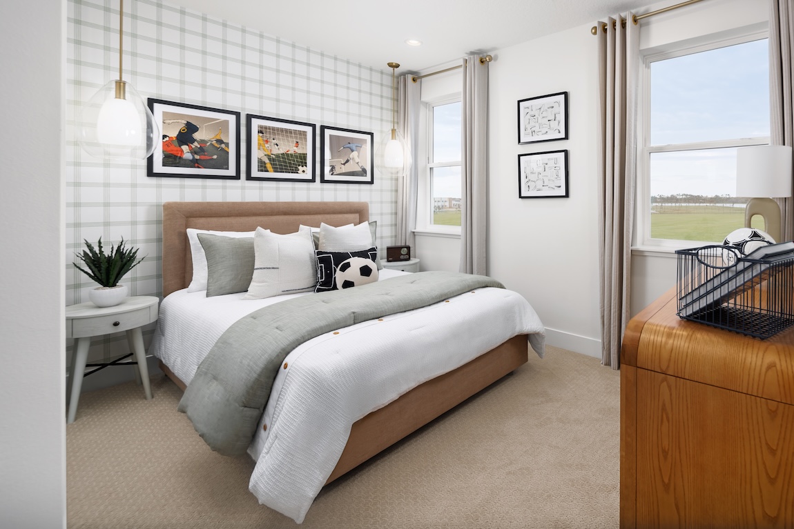 Soccer-themed bedroom with an accent wall.