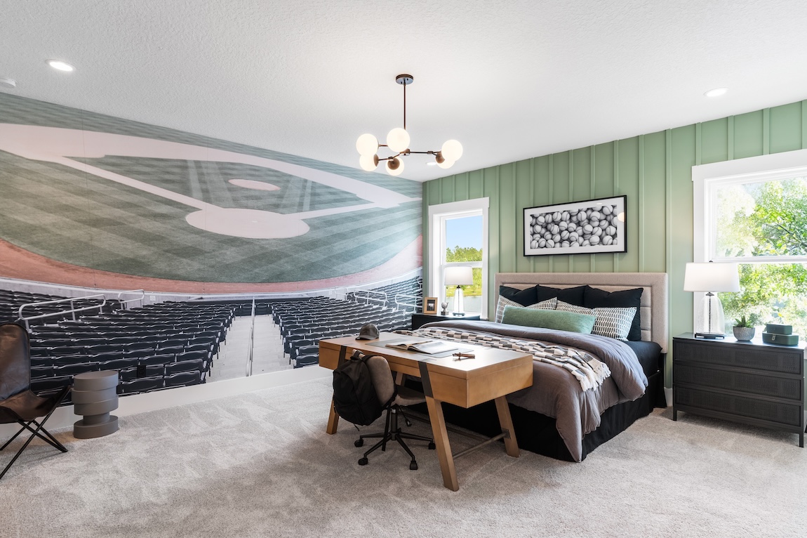 Baseball-themed bedroom with an accent wall and baseball decor.