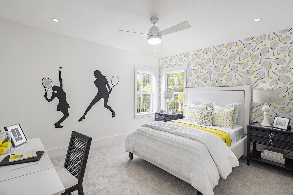 Tennis-themed bedroom with creative wallpaper and decor.
