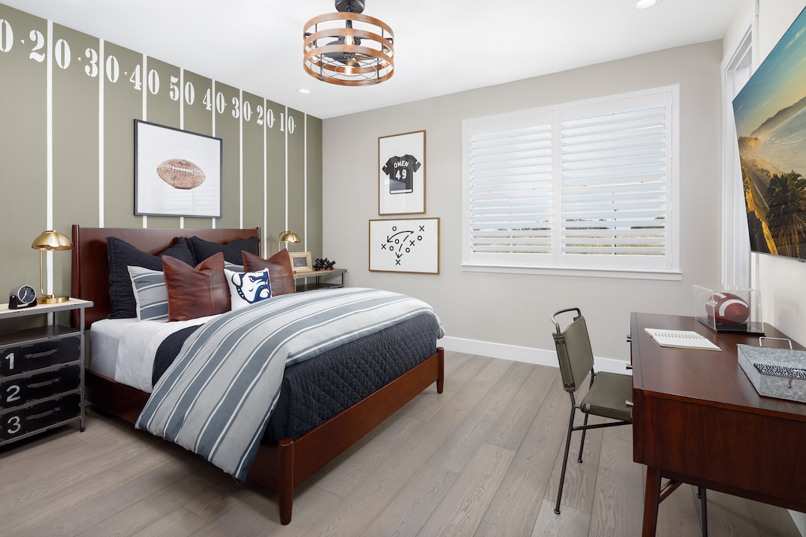 football-themed bedroom with accent wall resembling the field of play