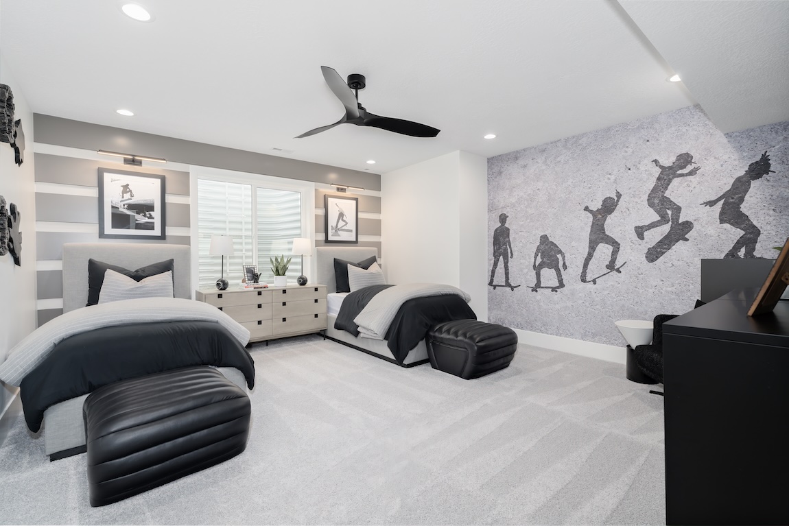 skateboarding-themed bedroom with energetic wall art portraying a kickflip