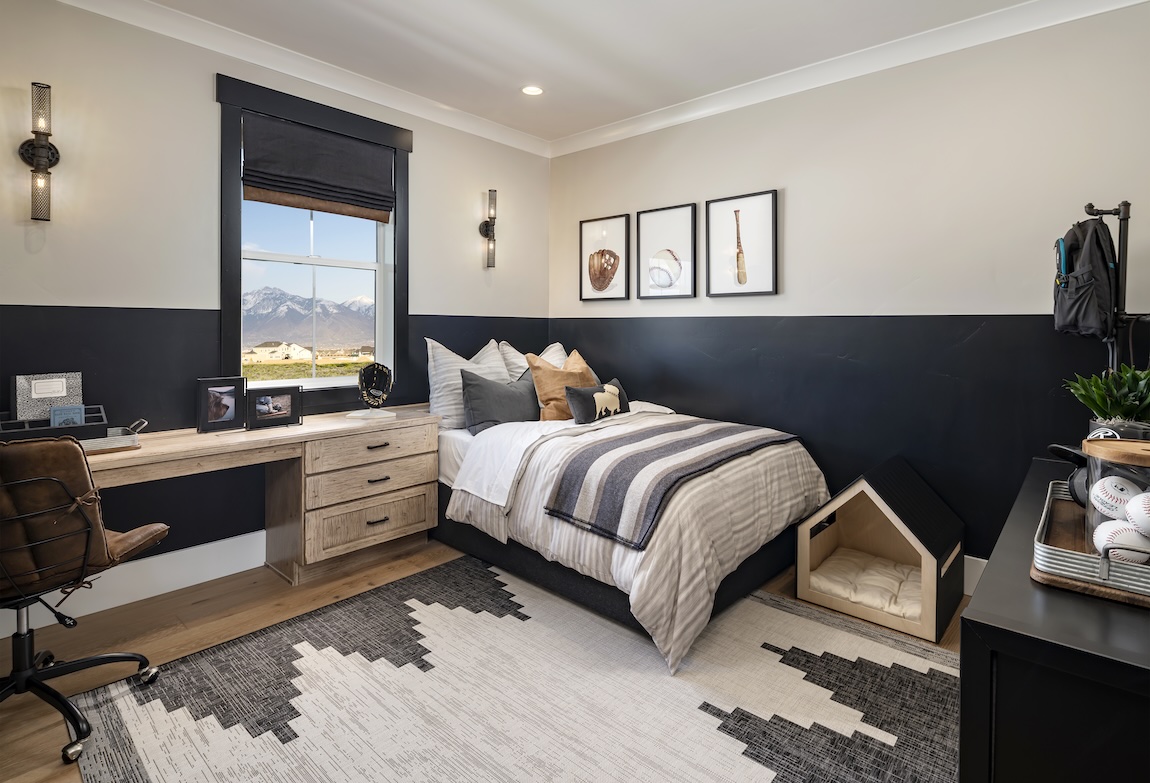 sports-themed bedroom with baseball art and dog bed