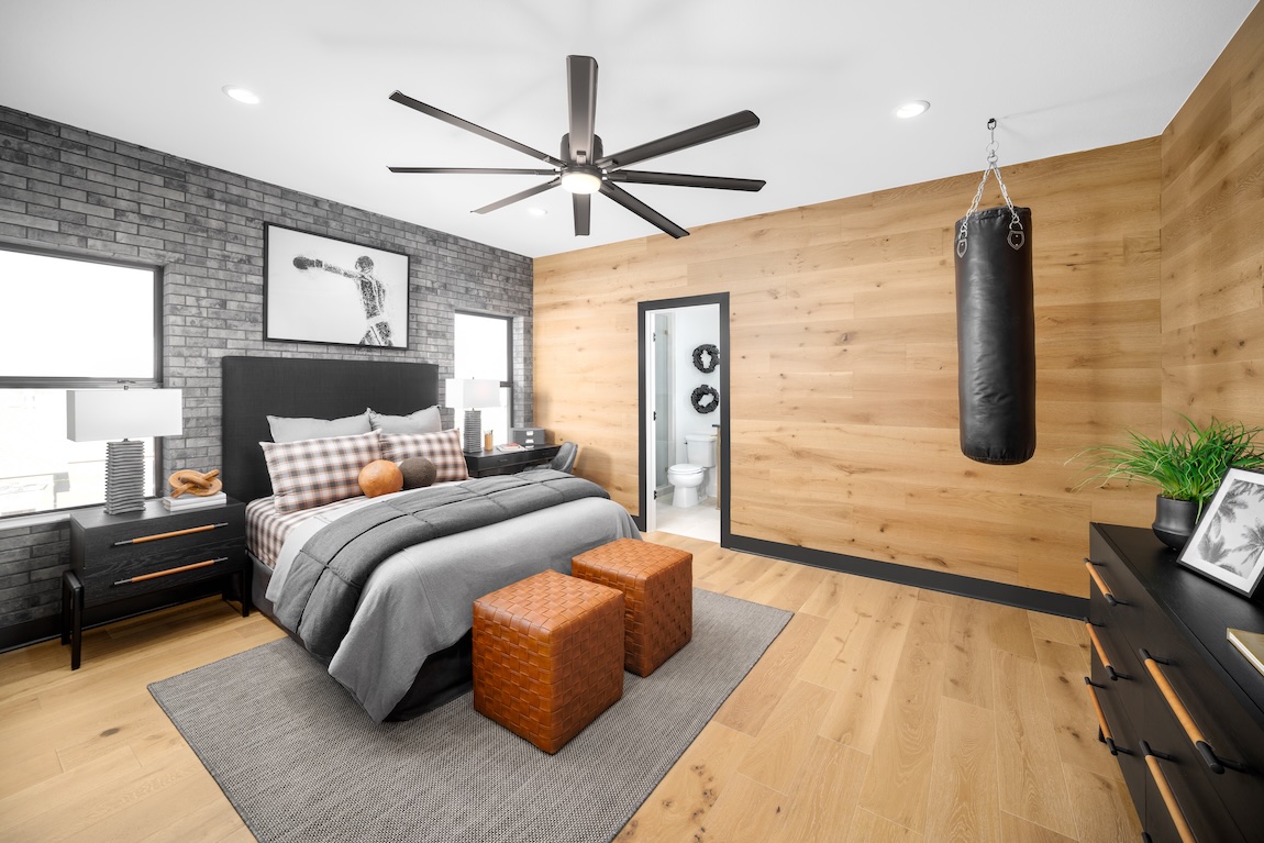 boxing-inspired bedroom with punching bag and wall art