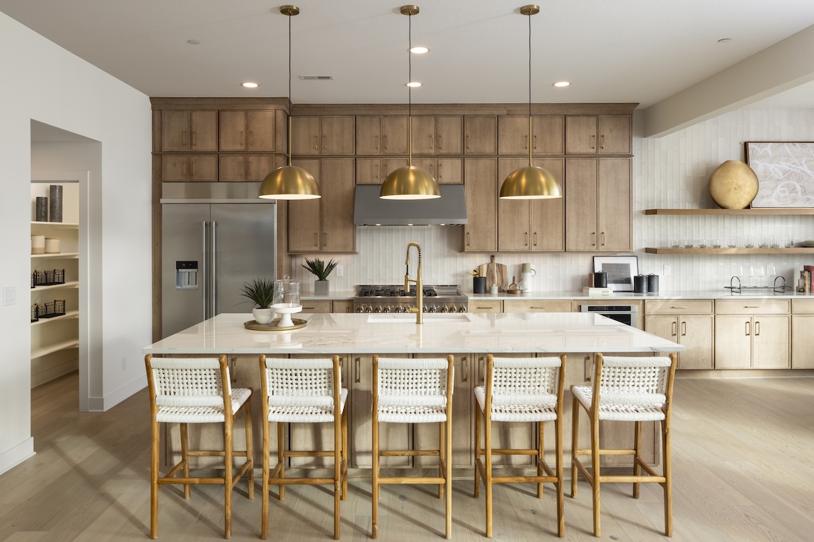 kitchen with wooden cabinetry and gold fixtures