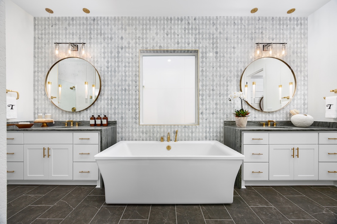 modern bathroom with freestanding tub and tile wall