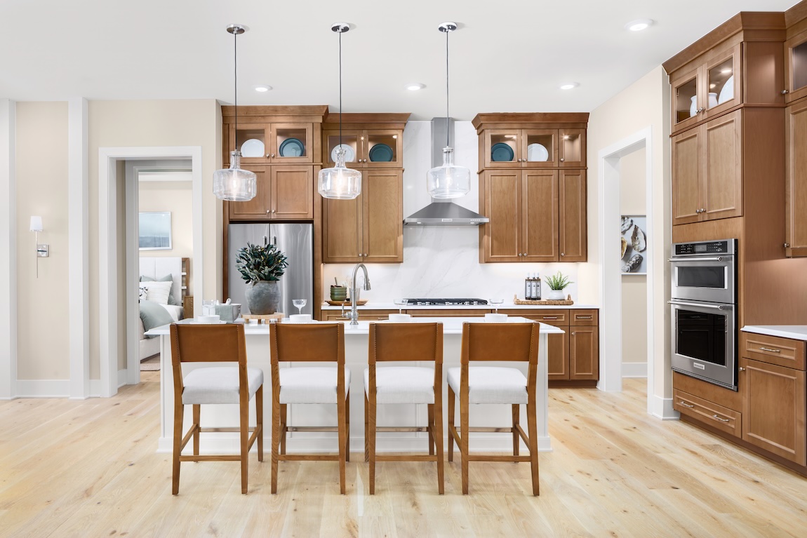 modern kitchen with wooden cabinetry and a spacious island