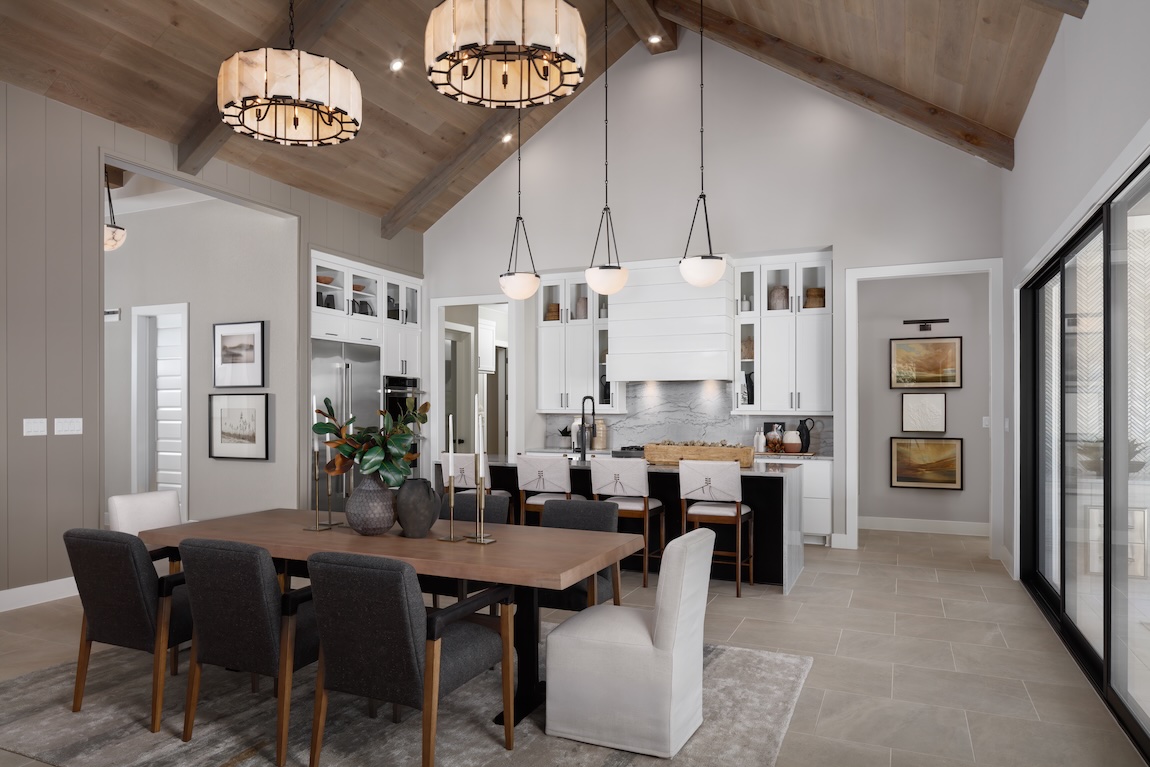 Modern home dining room and kitchen with glass sliding doors